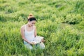 Young beautiful asian woman sitting and reading book in the mead Royalty Free Stock Photo