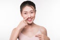 Young beautiful asian woman with smiley face touching her nose. Royalty Free Stock Photo