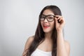 Young beautiful Asian woman with smiley face wearing glasses. Royalty Free Stock Photo