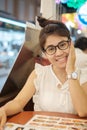 Young beautiful asian woman smiling when looking menu dinner time in restaurant or coffee shop Royalty Free Stock Photo