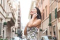 Young asian woman smiling with mobile phone urban outdoor Royalty Free Stock Photo