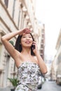 Young beautiful asian woman smiling using mobile phone urban out Royalty Free Stock Photo