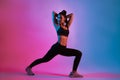 Young beautiful Asian woman in sports outfits doing stretching before workout in fitness. Healthy young woman warming up Royalty Free Stock Photo