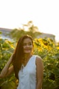 Young beautiful Asian woman thinking while fixing hair in the fi Royalty Free Stock Photo