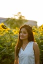 Young beautiful Asian woman thinking while looking at distance i Royalty Free Stock Photo