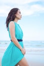 Young beautiful asian woman is walking along the beach Royalty Free Stock Photo