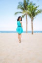 Young beautiful asian woman is walking on the beach Royalty Free Stock Photo