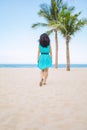 Young beautiful asian woman is walking on the beach Royalty Free Stock Photo