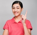 Young beautiful asian woman wore pink t shirt, Showed idea expression , on gray background