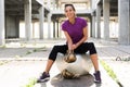 Young beautiful athlete girl wearing gold boxing gloves sitting Royalty Free Stock Photo