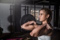 Young beautiful attractive muscular and strong fit girl holding heavy barbell weight with her hands ready for snatch hardcore cros Royalty Free Stock Photo