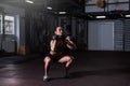 Young beautiful attractive muscular and strong fit girl holding heavy dumbbell weights with her hands ready for snatch hardcore cr Royalty Free Stock Photo