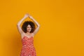 Young beautiful attractive smiling happy curly woman with raised arms Royalty Free Stock Photo