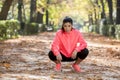 Attractive sport woman in runner sportswear breathing gasping and taking a break tired and exhausted after running workout on Autu Royalty Free Stock Photo