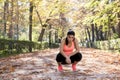 Attractive sport woman in runner sportswear breathing gasping and taking a break tired and exhausted after running workout on Autu Royalty Free Stock Photo