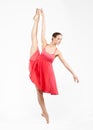 Young beautiful ballerina on a gray background