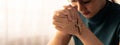 Young beautiful believer prays for happiness while holding crucifix. Burgeoning. Royalty Free Stock Photo