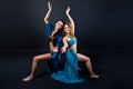Young beautiful belly dancers in blue costumes Royalty Free Stock Photo