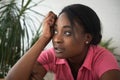 Young beautiful black woman suffering from depression sitting at her table at home and feels disappointed sad and depressed Royalty Free Stock Photo