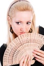 Young beautiful blond girl with a fan Royalty Free Stock Photo