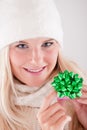 Young beautiful blond winter woman with gift Royalty Free Stock Photo