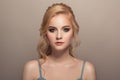 Portrait of young beautiful blond woman. Hairstyle and make-up. Royalty Free Stock Photo