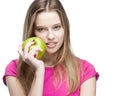 Young beautiful blond woman holding green apple Royalty Free Stock Photo