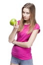 Young beautiful blond woman holding green apple Royalty Free Stock Photo