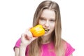 Young beautiful blond woman holding yellow papper