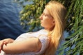 A young beautiful blonde Caucasian girl in a polka-dot dress Royalty Free Stock Photo