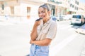 Young beautiful blonde caucasian woman smiling happy outdoors on a sunny day using smartphone Royalty Free Stock Photo