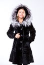 Young beautiful blonde girl in a black fur coat Royalty Free Stock Photo