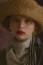 Young beautiful blonde girl in a straw hat Royalty Free Stock Photo