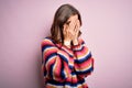 Young beautiful blonde girl wearing glasses and casual sweater over pink isolated background with sad expression covering face Royalty Free Stock Photo