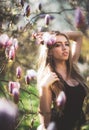 Young beautiful blonde woman in blooming garden. Beautiful natural woman with flowers. Spring girl portrait. Beauty Royalty Free Stock Photo