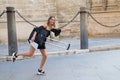 Young and beautiful blonde woman with her suitcase under her arm ready and waiting to start her holiday. Holiday and travel Royalty Free Stock Photo