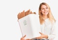 Young beautiful blonde woman holding recycle paper bin looking positive and happy standing and smiling with a confident smile Royalty Free Stock Photo