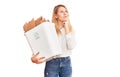 Young beautiful blonde woman holding recycle paper bin serious face thinking about question with hand on chin, thoughtful about Royalty Free Stock Photo