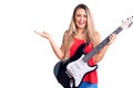 Young beautiful blonde woman playing electric guitar celebrating victory with happy smile and winner expression with raised hands Royalty Free Stock Photo