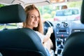 Young beautiful blonde woman smiling happy driving car Royalty Free Stock Photo