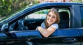 Young beautiful blonde woman smiling happy driving car Royalty Free Stock Photo