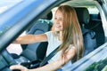 Young beautiful blonde woman smiling happy driving car Royalty Free Stock Photo