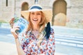 Young beautiful blonde woman on vacation wearing summer hat smiling happy Royalty Free Stock Photo