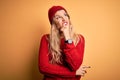 Young beautiful blonde woman wearing casual sweater and wool cap over white background Thinking worried about a question, Royalty Free Stock Photo