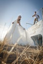 Young beautiful bridal couple flirting outdoors in the sun Royalty Free Stock Photo