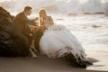 Young beautiful bridal couple having fun together at the beach Royalty Free Stock Photo