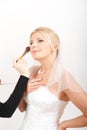 Young beautiful bride applying wedding make-up Royalty Free Stock Photo