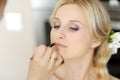 Young beautiful bride applying wedding make-up Royalty Free Stock Photo