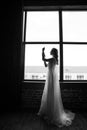 Young and beautiful bride blonde in a dark interior