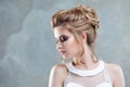 Young beautiful bride with an elegant high hairdo. Wedding hairstyle with the accessory in her hair Royalty Free Stock Photo